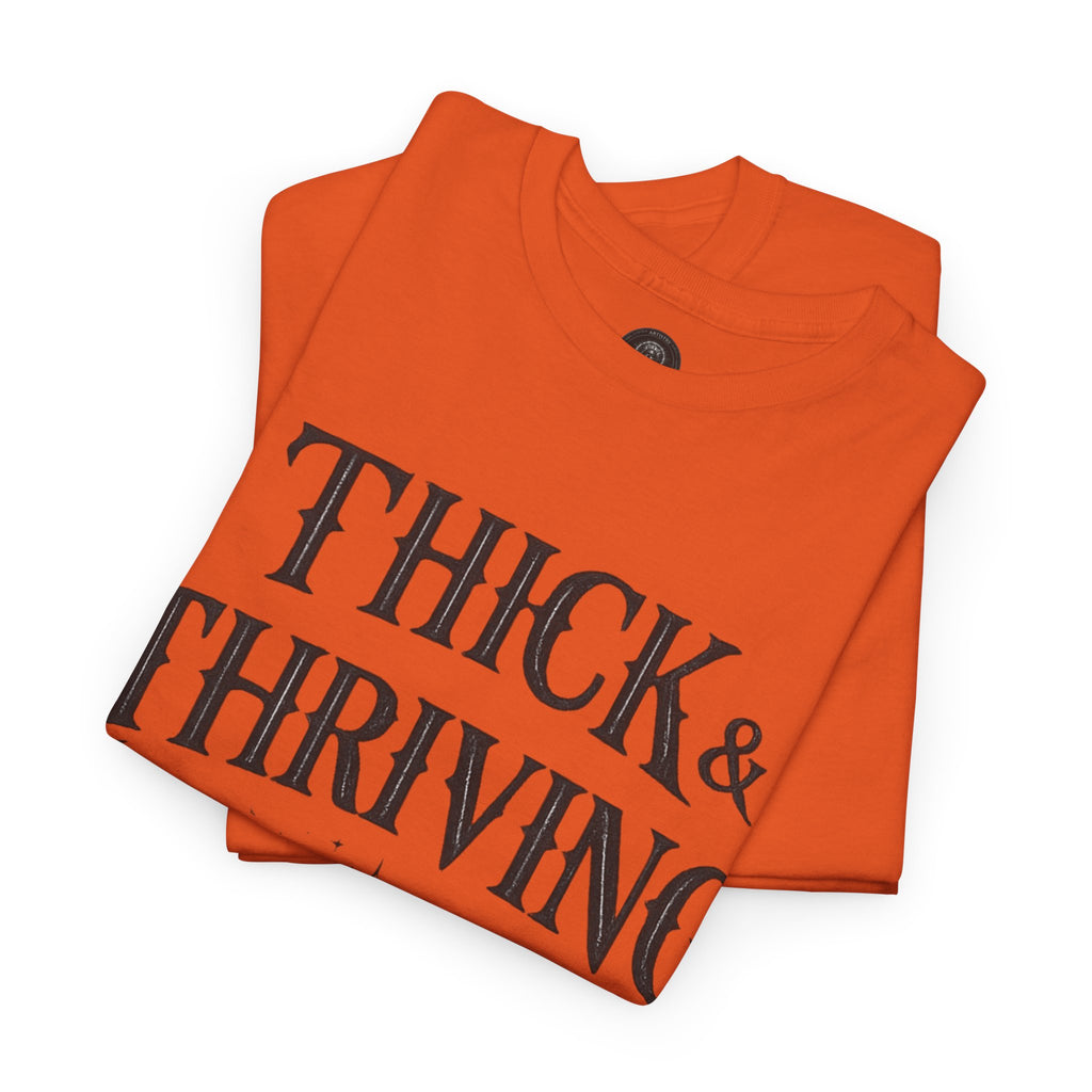 Thick & Thriving Graphic Tee — Bold Gothic Lettering with Distressed X Back